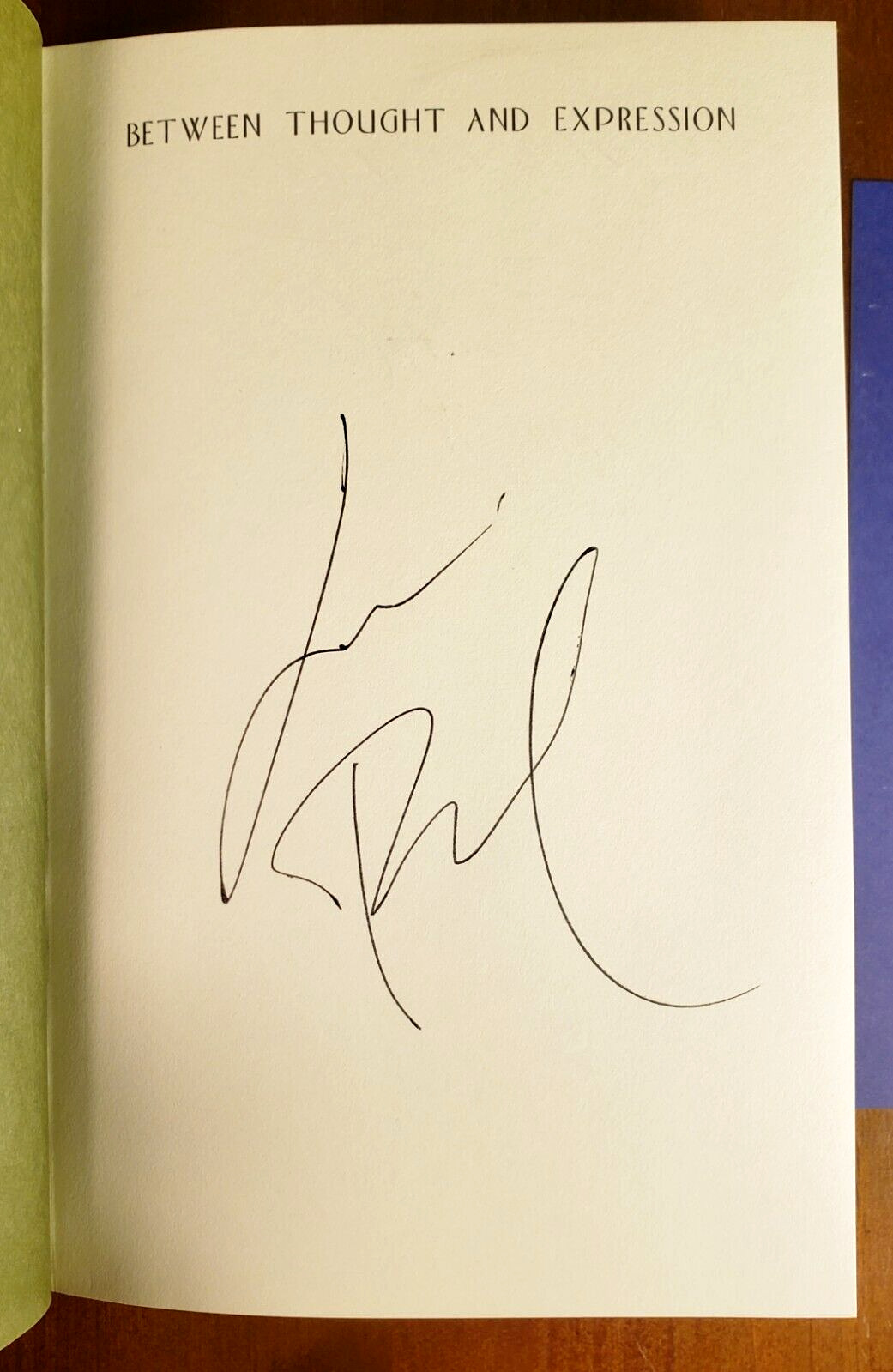 LOU REED SIGNED 'BETWEEN THOUGHT AND EXPRESSION SELECTED LYRICS' HARD COVER BOOK